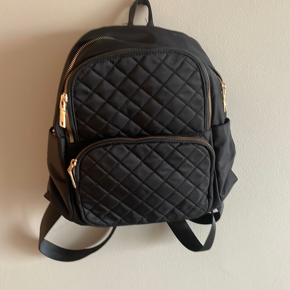 Black small backpack with gold hardware